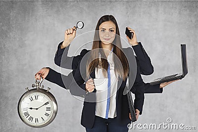 Multi-purpose business woman with a large number of hands Stock Photo