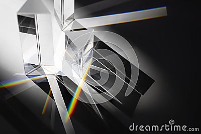 Multi triangular Prism dispersing sun beam splitting into a spectrum on white background Stock Photo