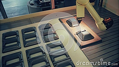 A multiaxis robotic scanner circles around a series of automotive components on a workstation generating data points Stock Photo