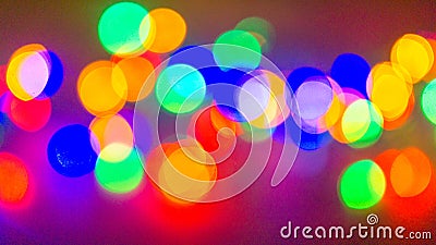 Multicolor Blurry christmas lights on a Black background Stock Photo