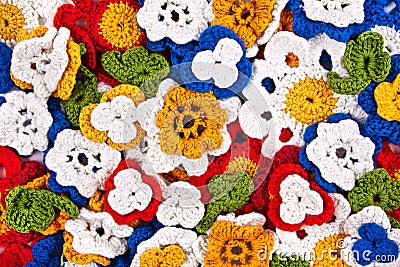 Multicolor crocheted flowers background Stock Photo