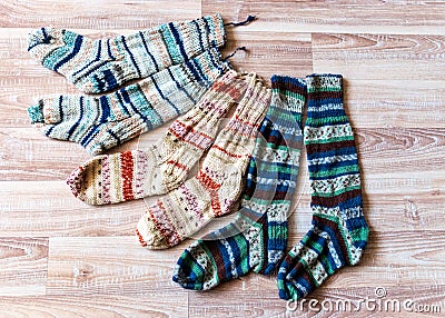 multicolor hand knitted different sizes and different colors warm winter wool knitted sock,s waiting for winter Stock Photo