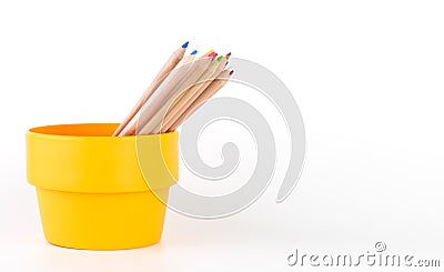 Multicolor pencils in orange bucket isolated Stock Photo