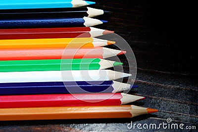 Multicolor pencils on wooden background Stock Photo