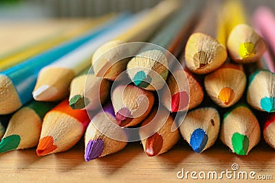 Multicolor pencils on wooden background. Stock Photo