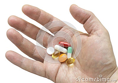 Multicolor pills in your palm Stock Photo