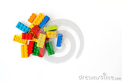 Lego backround. Multicolor Plastick constructor bricks on white background. Popular toys. Copyspace Stock Photo