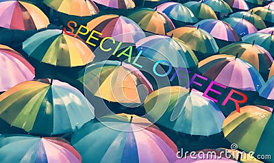 Multicolor umbrellas with the inscription `Special offer`. Stock Photo