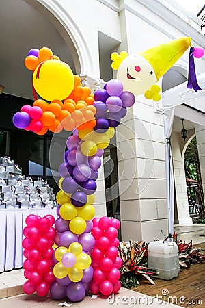 Multicolored balloons arranged in a big clown. Set in a Feast Stock Photo