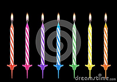 Multicolored birthdays candles isolated on black background Stock Photo