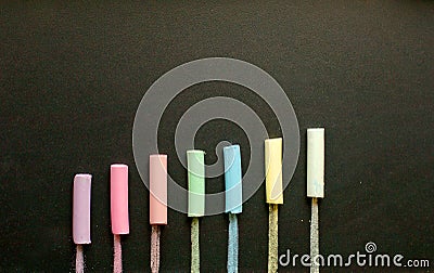 Multicolored chalk on slate Stock Photo