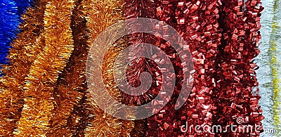 Multicolored christmas serpentine garlands for christmas tree background Stock Photo