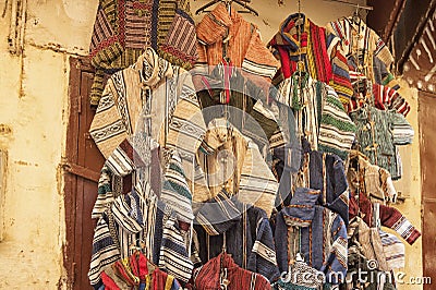 Multicolored clothes on a souk in Fez, Morocco Stock Photo