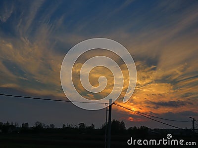 Multicolored clouds at sunset in autumn Stock Photo