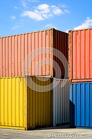 Multicolored containers stacked in an industrial park Stock Photo
