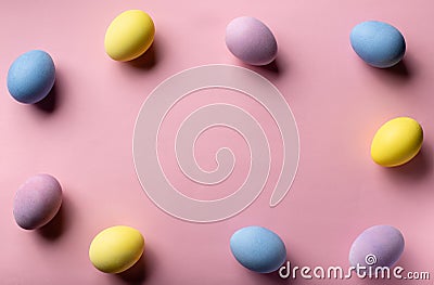 Multicolored decorated eggs on a pink background. easter concept. Stock Photo