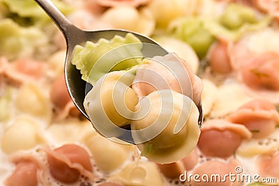 Multicolored dumplings are cooked in the kitchen Stock Photo