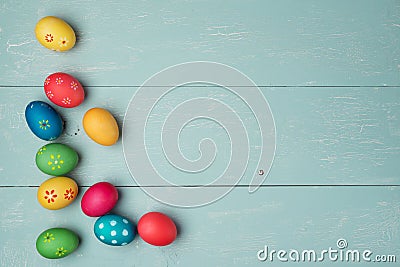 Multicolored easter eggs on vintage wooden background Stock Photo