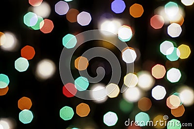 multicolored festive lights on a black background screensaver backdrop Stock Photo