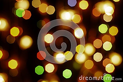 multicolored festive lights on a black background screensaver backdrop Stock Photo