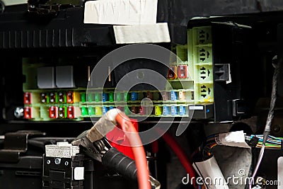 Fuse box in the car`s electrical circuit during vehicle repair in the workshop. Auto service industry Stock Photo