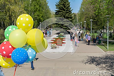 Multicolored gel balloons in the hand of a people Stock Photo