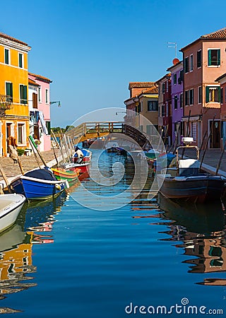 Multicolored houses and boats on Burano Editorial Stock Photo