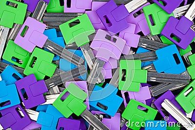 Multicolored key blanks with plastic heads. Stock Photo