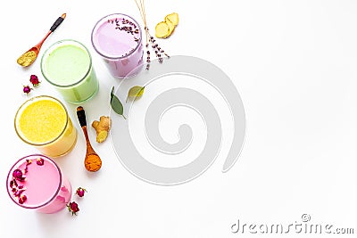 Multicolored lattes tea or coffee. Blue, yellow green and pink latte top view Stock Photo