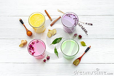 Multicolored lattes tea or coffee. Blue, yellow green and pink latte top view Stock Photo