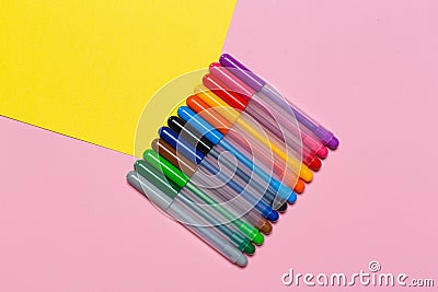Multicolored markers on a colorful background Stock Photo