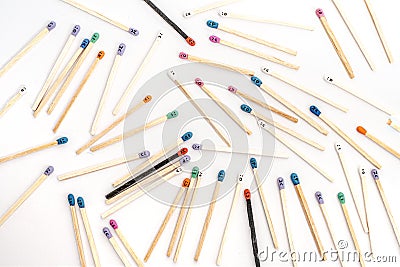 Multicolored matchsticks with faces painted Stock Photo