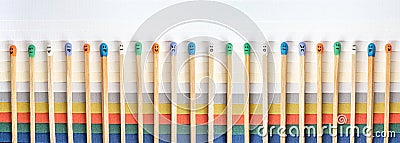 Multicolored matchsticks with faces painted Stock Photo