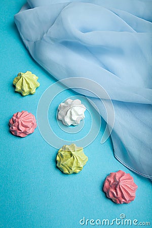 Multicolored meringue, prepared from a mixture of well-beaten egg whites and sugar, baked until crisp. The atmosphere of love and Stock Photo