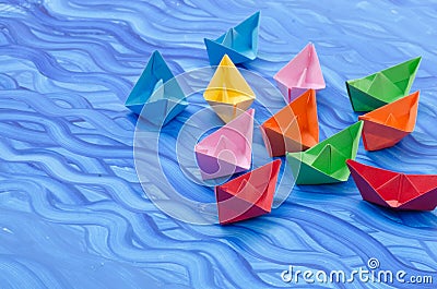 Multicolored paper origami boats Stock Photo