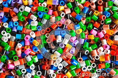 Multicolored plastic hama beads toy for kids. Stock Photo