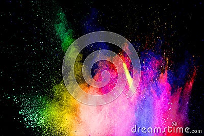 Multicolored powder explosion on black background.Abstract colorful dust particles textured background Stock Photo