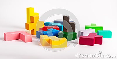 Multicolored puzzle toy elements. Chaos, disorder, work beginning concept. Wooden kids game for logical thinking Stock Photo