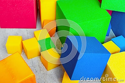 Multicolored soft foam cubes at children playground. Bright colorful toys. Kids party entertainment and decoration Stock Photo