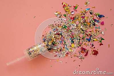 Multicolored sparkling candy on a pink background. Stock Photo