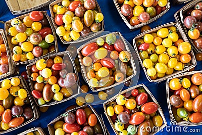 Multicolored tomatoes, pattern of yellow, red and orange cherry tomatoes Stock Photo