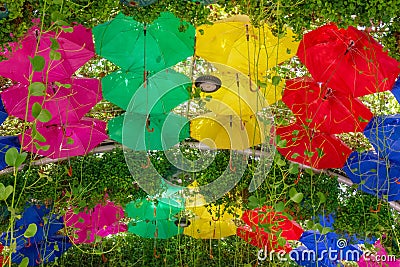 Multicolored umbrellas park decorative design Editorial Stock Photo