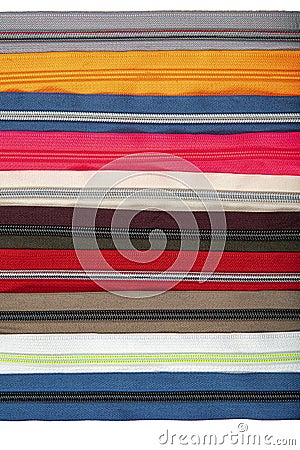 Multicolored Zippers or Zip Fasteners used for binding fabric or textile. Colorful Clasp Lockers Background or Pattern concept of Stock Photo