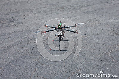 Multicopter is landing to the ground Stock Photo