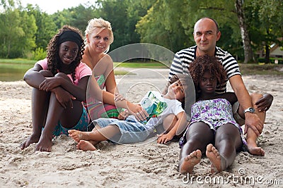 Multicultural family on the beach Stock Photo