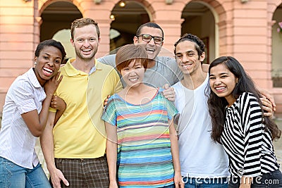 Multicultural group of people posing for portrait Stock Photo