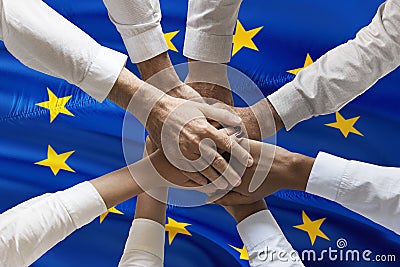 Multicultural hands union concept over european flag Stock Photo