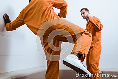 multicultural prisoners fighting Stock Photo