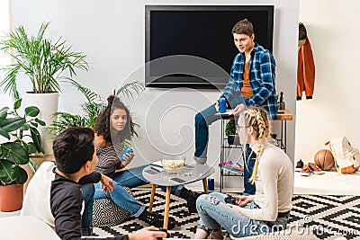 multicultural teens talking and drinking soda Stock Photo