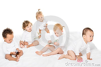 group of adorable multicultural toddlers with cash and credit cards Stock Photo